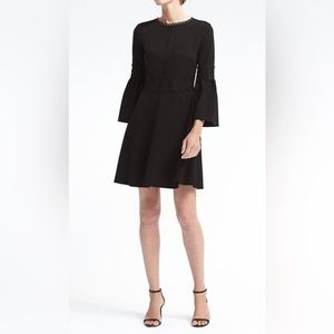 Gorgeous 2P black Banana Republic mini dress with lace detail and bell sleeves